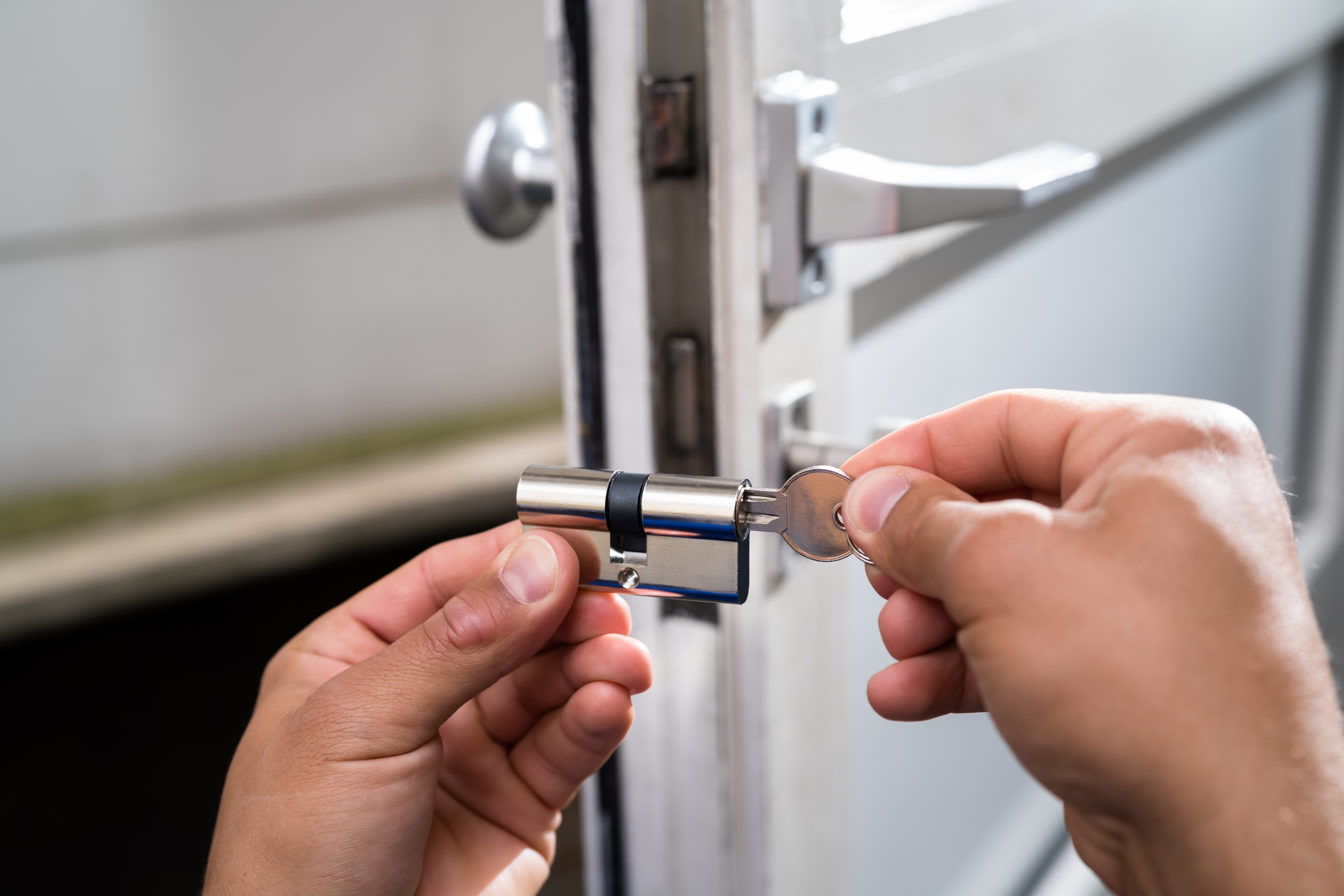 Locksmith Lock Door Repair. Worker Changing